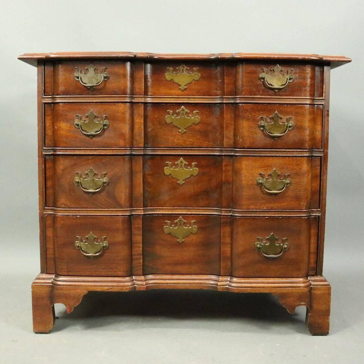 Vintage Chippendale style butler's chest features mahogany construction with four drawer block front design and bronze pulls, circa 1940

Measures: 32" H x 36" W x 20" D.