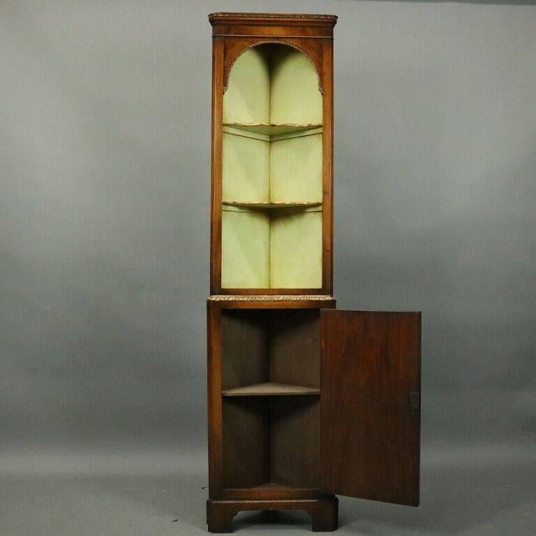 Antique Continental style miniature corner cupboard features two open shelves above blind cabinet, circa 1910

Measures: 66.5" H x 16" W x 11" D.