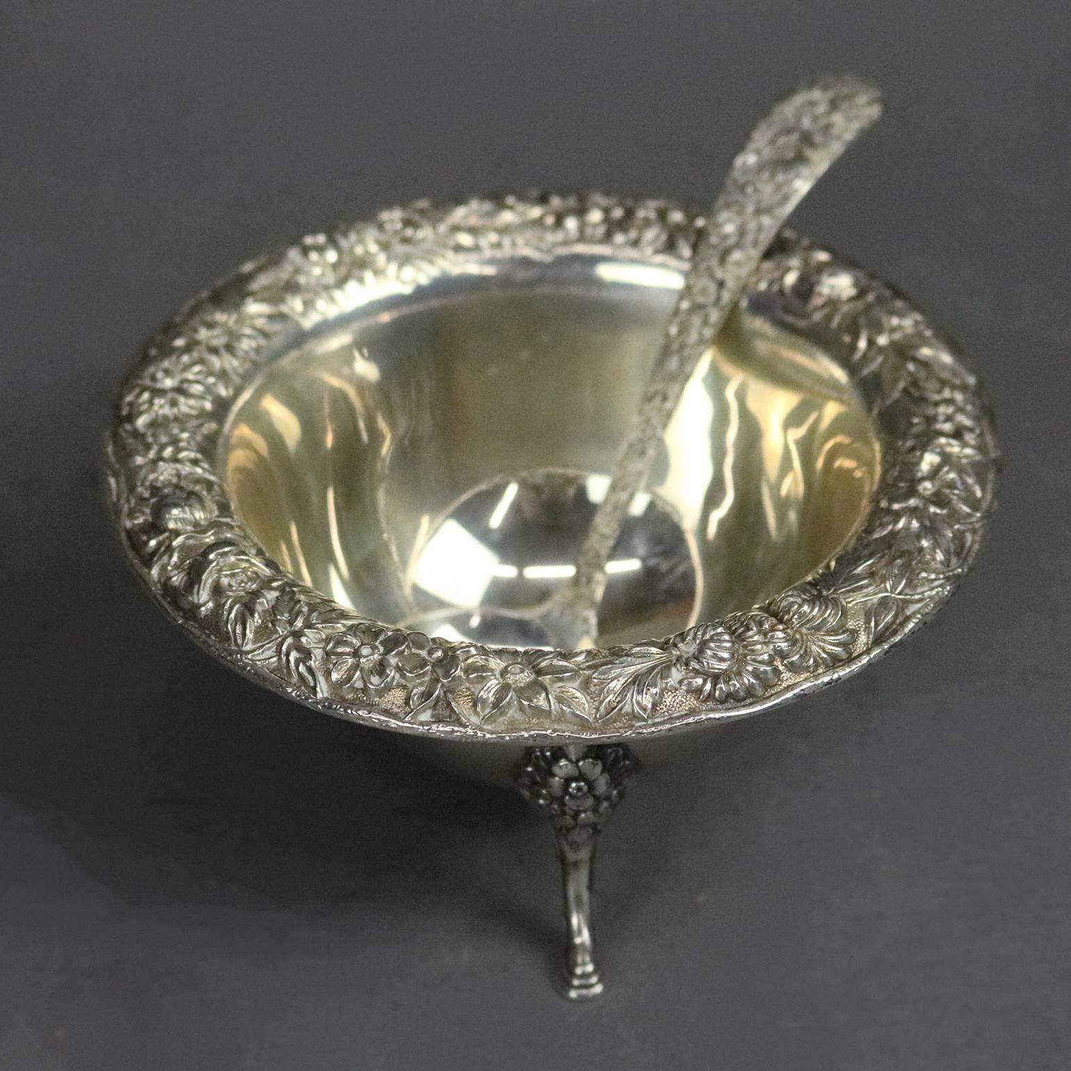 Antique sterling silver footed sauce bowl and ladle by S. Kirk & Sons Co. feature Repousse high relief floral motif, circa 1900

Measures: 2.5" H x 5" D; 5.7 troy ounces.