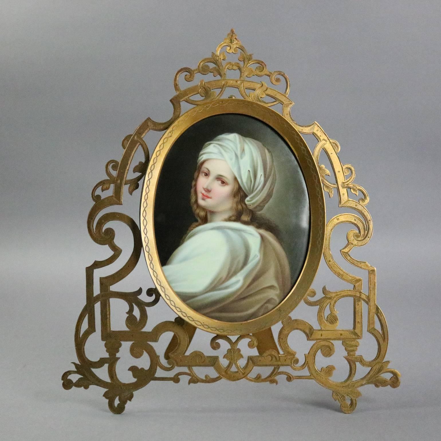 Antique KPM style porcelain portrait plaque depicting Beatrice Cenci (Italian, 1577-1599), a portrait variously attributed to Reni or Sirani, housed in pierced bronze scroll and foliate decorated frame, circa 1890

Measures: 12" H x 10"