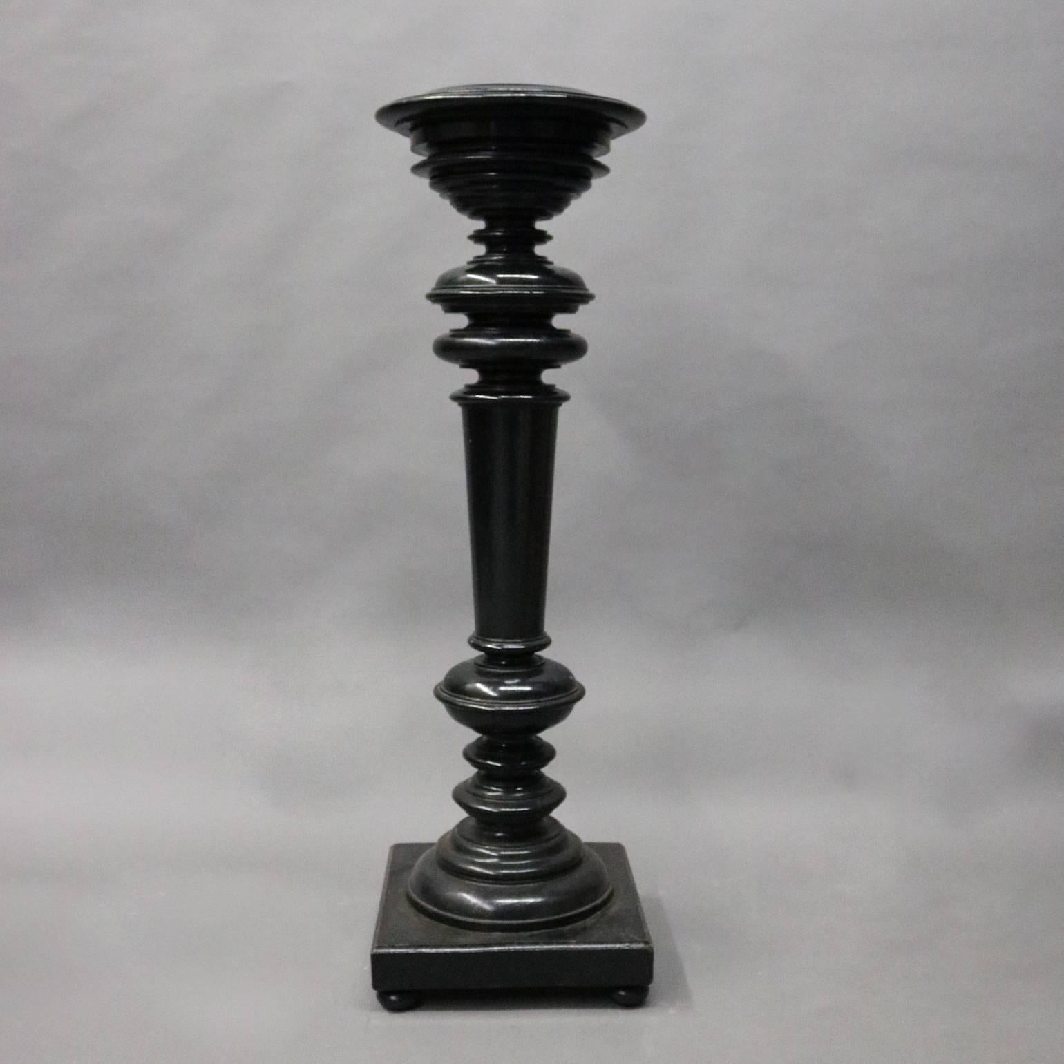 Antique sculpture features ebonized wood construction with graduated stepped art display over turned shaft seated atop square base with pad feet, circa 1890

Measures: 48