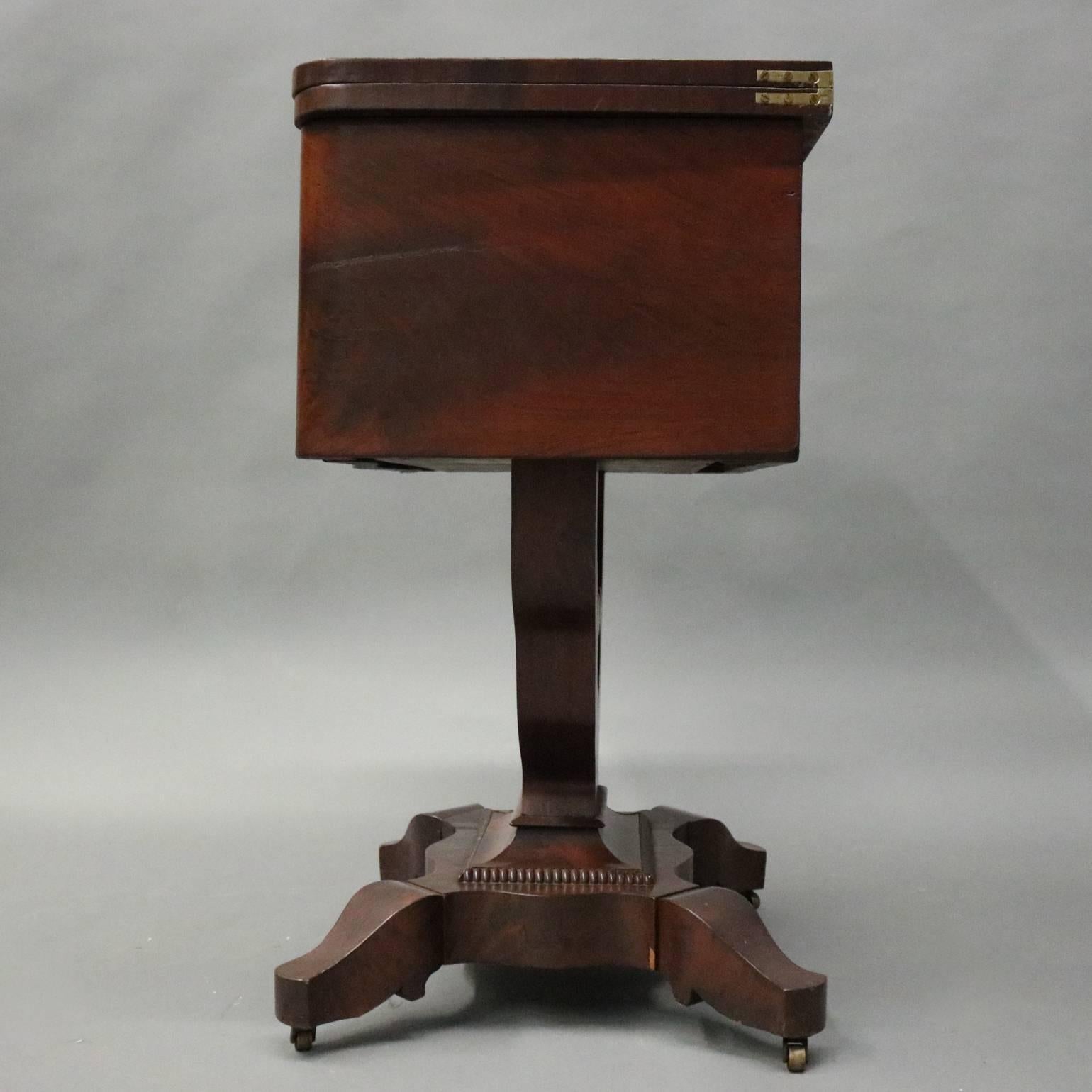 American Empire Antique Flame Mahogany Front Two-Drawer Flip-Top Sewing Stand, circa 1880