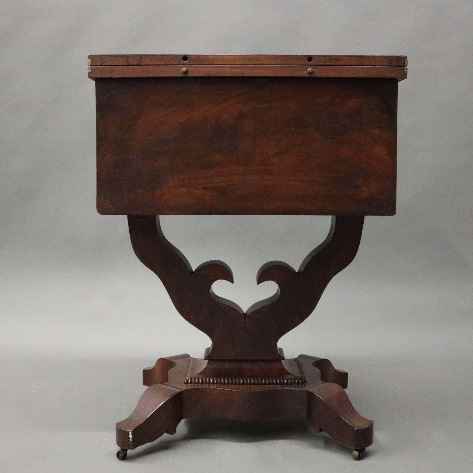 American Antique Flame Mahogany Front Two-Drawer Flip-Top Sewing Stand, circa 1880