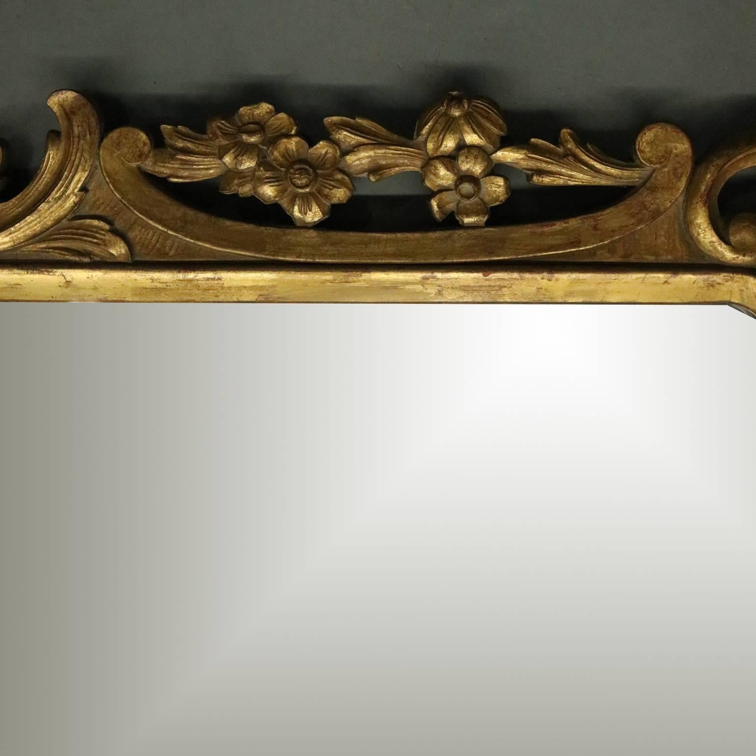 Antique French gold giltwood wall mirror features pierced surround with scroll, foliate and gadrooning, circa 1920

Measures - 45