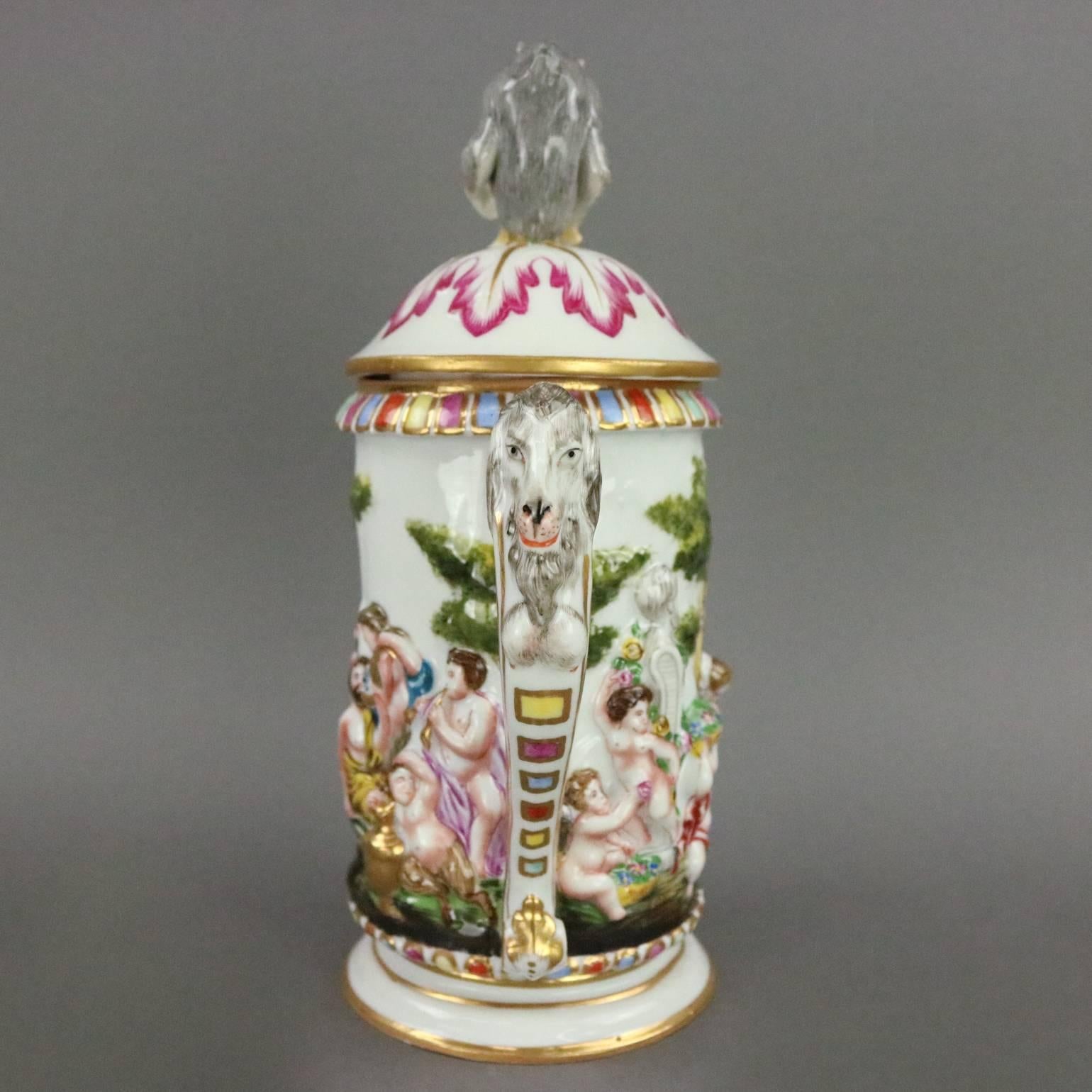 Antique Italian capodimonte lidded stein features high relief hand-painted and gilt scene depicting Roman celebration, figural monkey finial, and goat on handle, underglaze blue Crown N mark on base, circa 1890.

Measures: 9.5" H x 6" W
