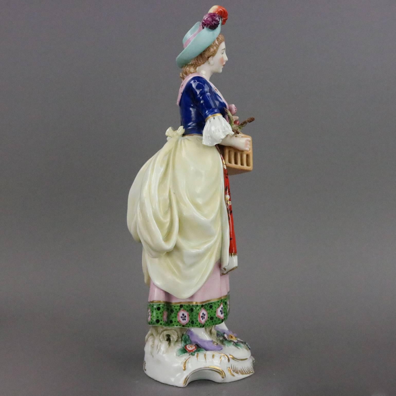Antique English Chelsea hand-painted porcelain figure of woman with her bird and carrying a birdcage, highly detailed, gold anchor Chelsea maker mark on base, circa 1820.

Measures: 9" height X 3.5" diameter.
