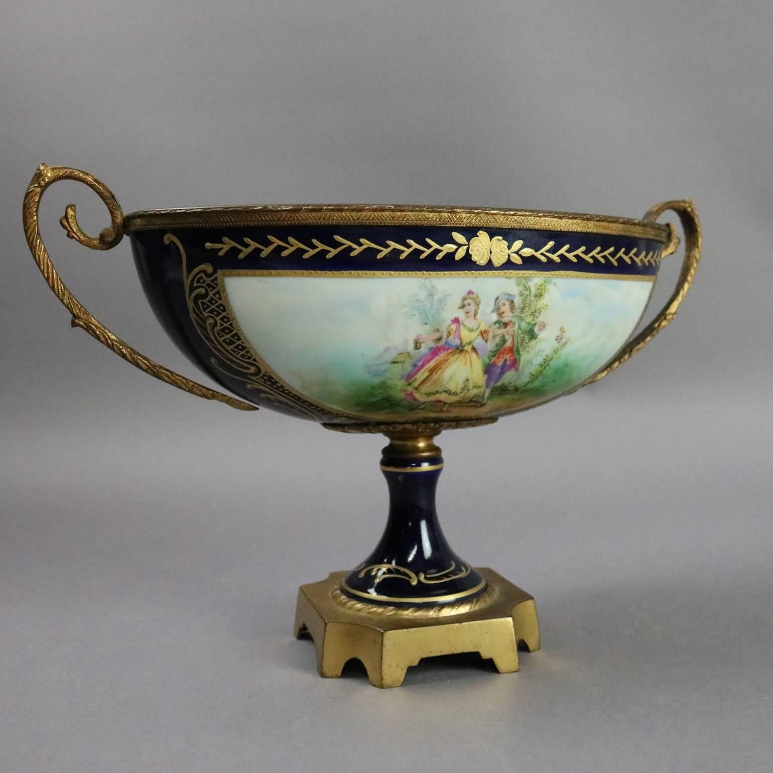 Antique French porcelain Sevres style double handle compote features hand-painted courting scene reserve artist signed Sigfried, gilt foliate decorations, bronzed white metal mounts, circa 1880

Measures: 7.5" H x 11" W x 5" D.
 