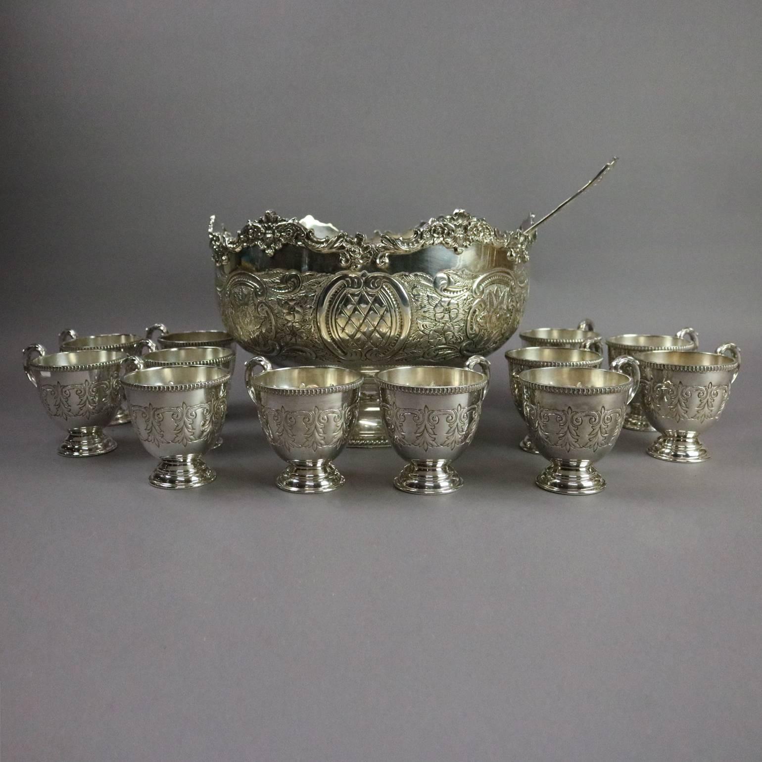 Vintage English silver plate punch bowl with twelve handled cups by Sheffield feature embossed scroll, floral and foliate design; ladle by Rogers, circa 1940

Measures: 8" H x 12" diameter bowl; 4" H x 4" diameter cups.