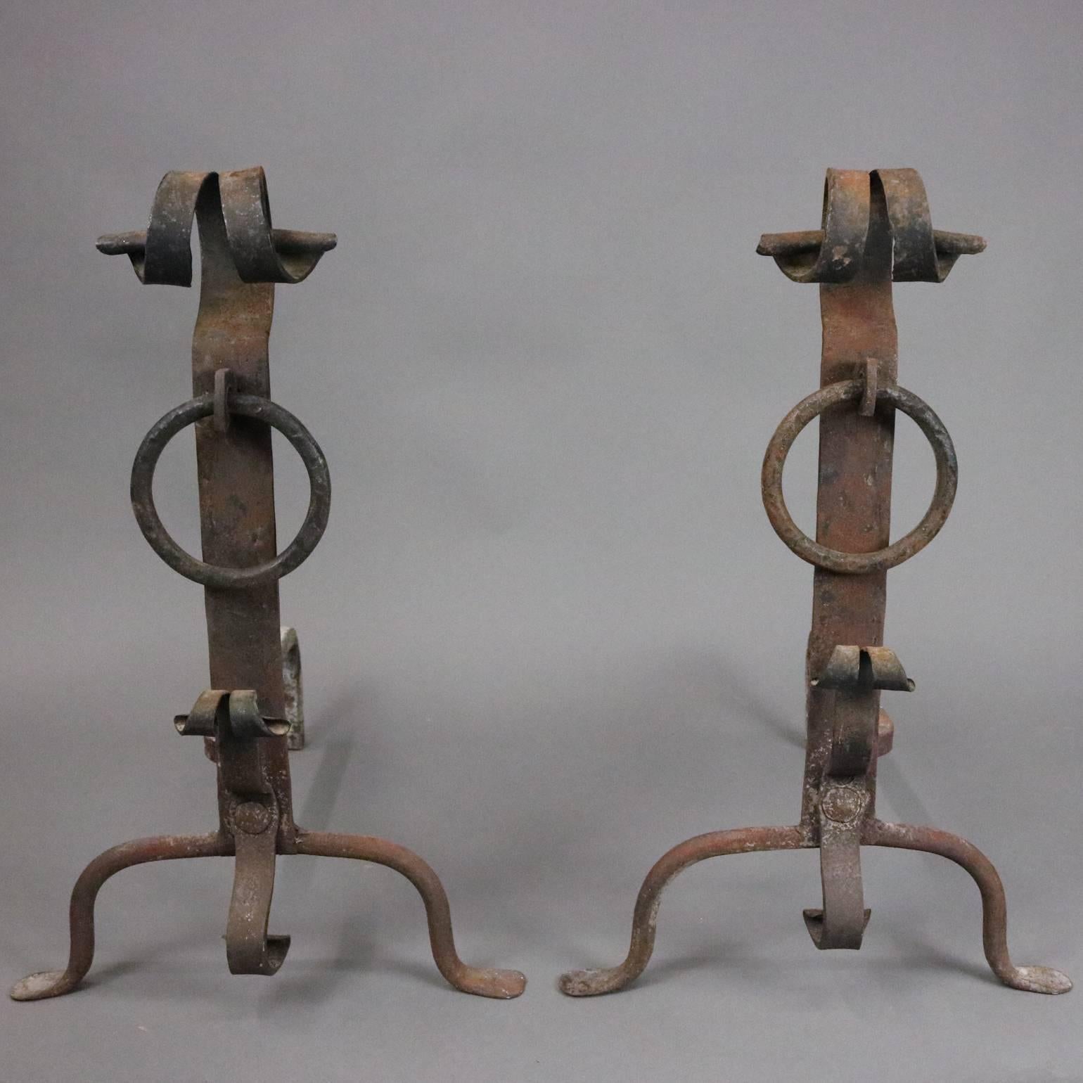 Pair antique Old World England hand-forged wrought iron fireplace andirons feature divided curled finial, shaft ring, curled or scrolled base decoration, seated on arched legs, circa 1820

Measure: 21" H x 13.5" W x 18.5" D.