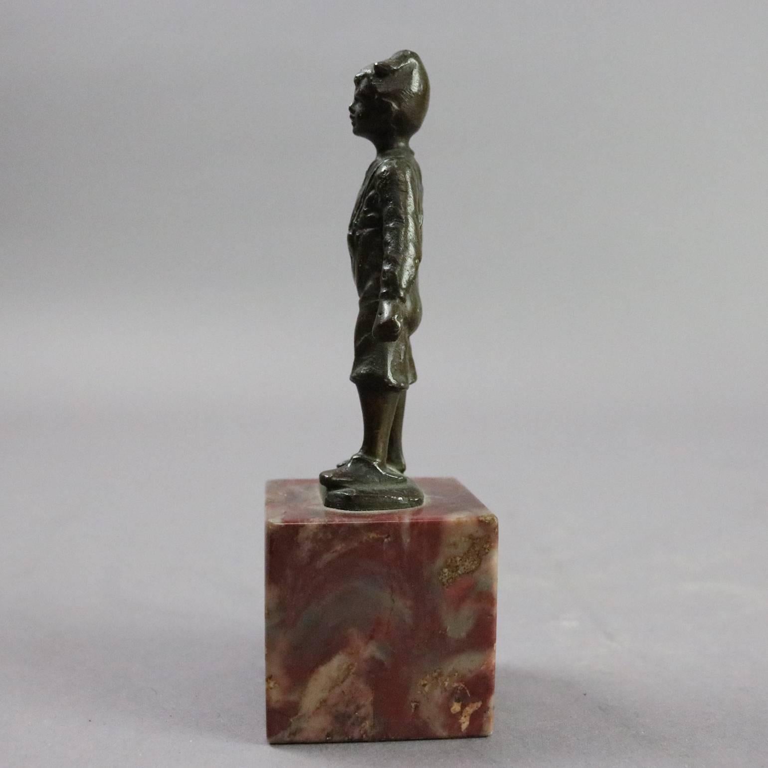 19th century antique figural cast bronze sculpture depicts young boy, street urchin, holding his shoe, seated on marble base.

Measures: 5" H x 1.75" W x 1.75" D.