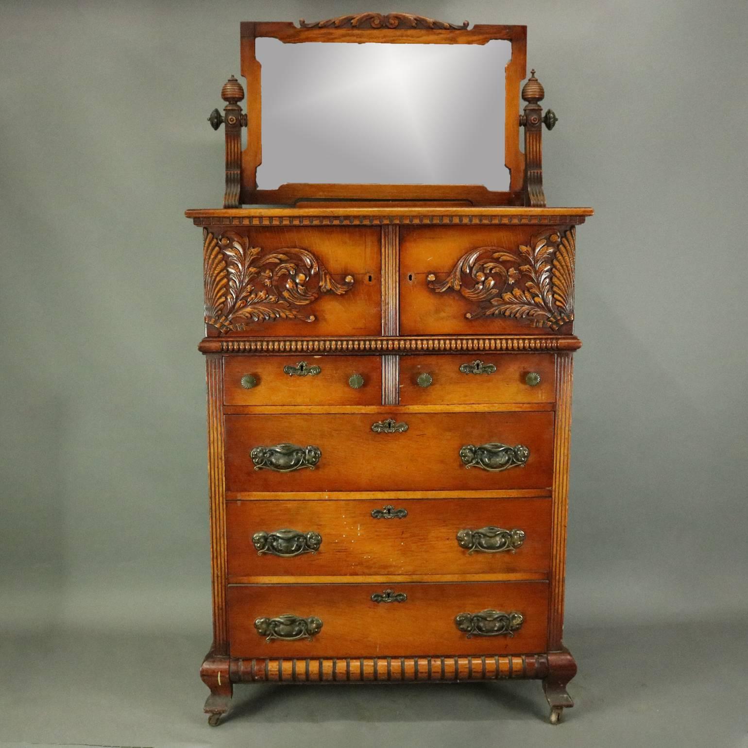 Oversized antique oak bonnet chest features two bonnet compartments over two small and three long drawers, carved foliate and shell decoration, dental and beaded molding, reeded mirror supports with beehive finials, bronze pulls, circa