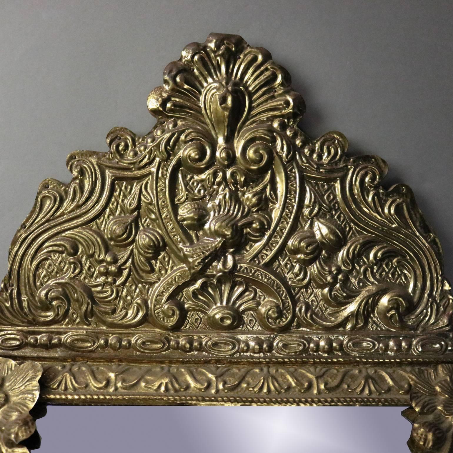 Antique French Baroque style wall cabinet features bronze construction with elaborate floral and scroll decoration on the frame and crest, mirrored door opens to reveal interior cabinet with hooks, circa 1920

Measures: 24” H x 13.5” W x 2.25” D