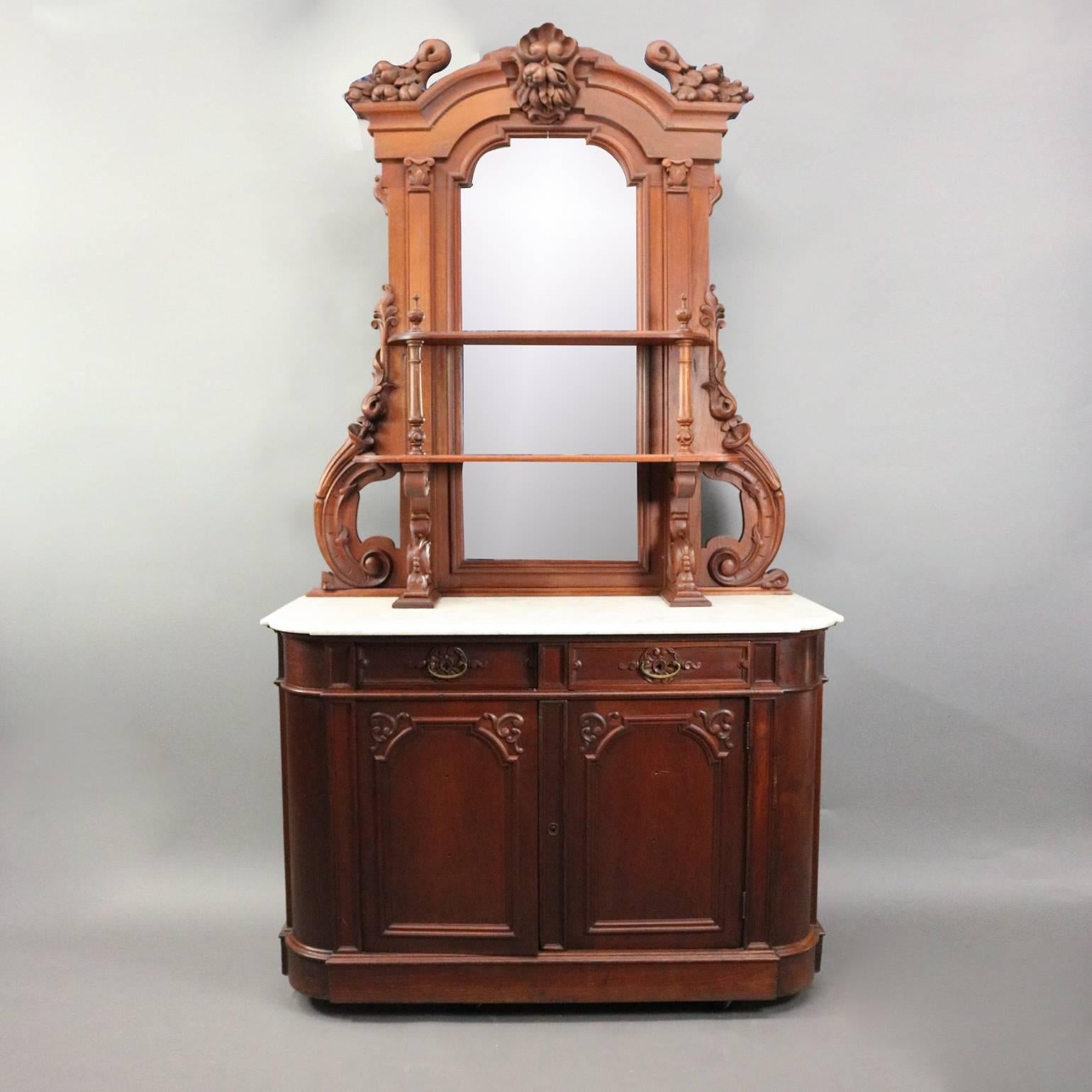 Antique Renaissance Revival sideboard features heavily carved walnut case with volute, fruit and nut motif, marble top, and shelved mirrored backsplash, circa 1880.

***DELIVERY NOTICE – Due to COVID-19 we are employing NO-CONTACT PRACTICES in the
