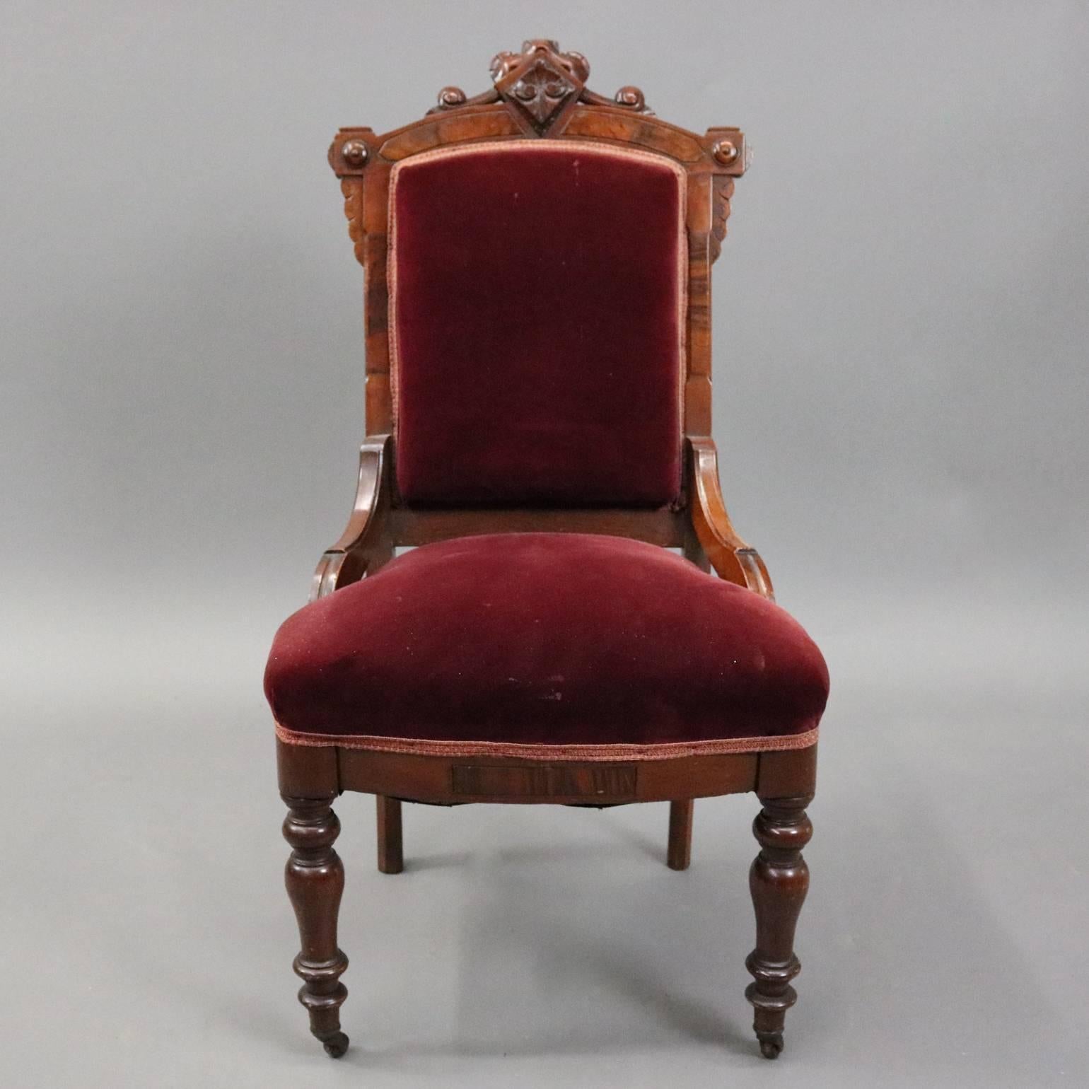 Set of six antique Eastlake dining chairs feature carved walnut frames with red velvet upholstered seats and backs, circa 1890

Measure: 38" H x 20" W x 17" D, 17" seat height.