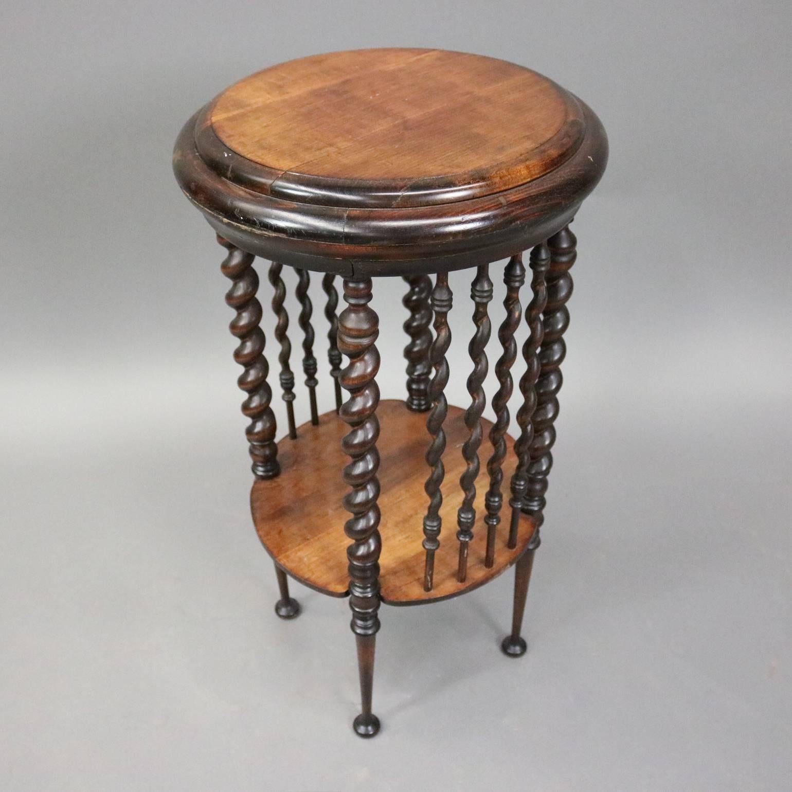 Antique mahogany plant stand features barley twist legs and spindles, circa 1900

Measures: 30" H x 16" diameter.