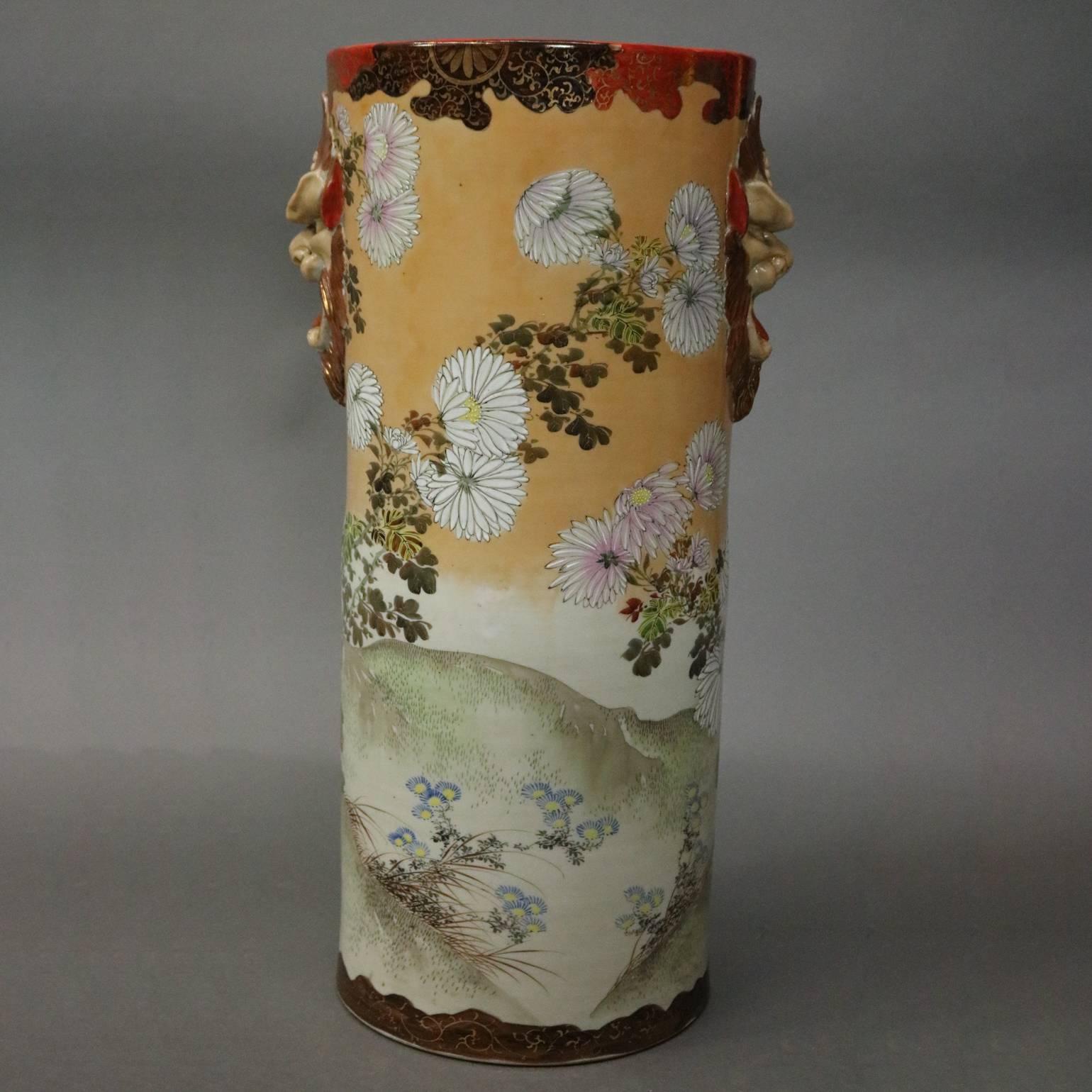 Antique Japanese Satsuma porcelain umbrella stand features floral scene with birds and has applied figural Oni (Japanese devil figure) handles, circa 1880

Measures - 24" H x 12" diameter

FYI.....Oni (?) are a kind of yokai from