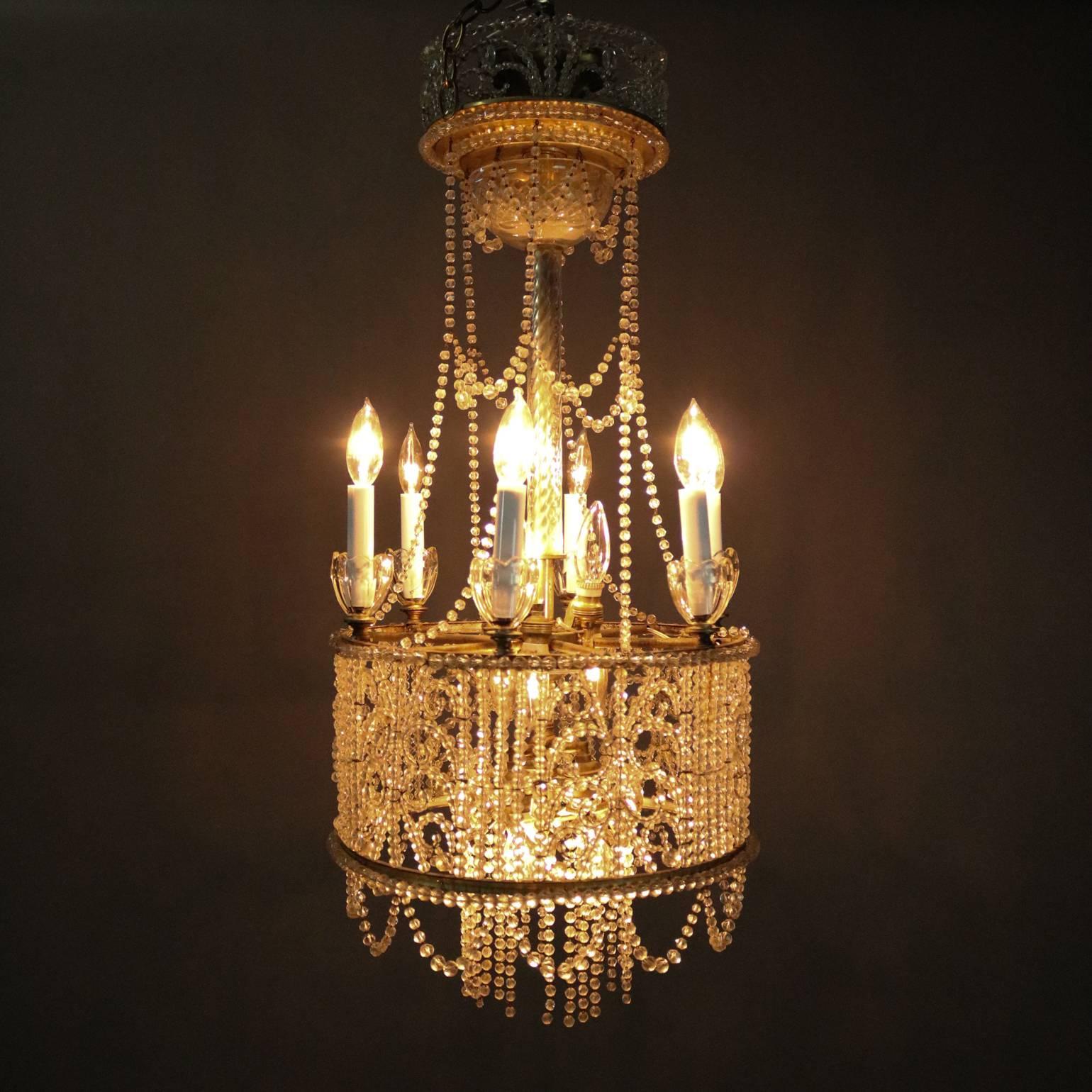 Antique French Art Nouveau chandelier features strung crystal beads in feathered, scroll and swag patterns, reminiscent of wedding cake, circa 1920

Measures: 36" drop x 16"diameter.