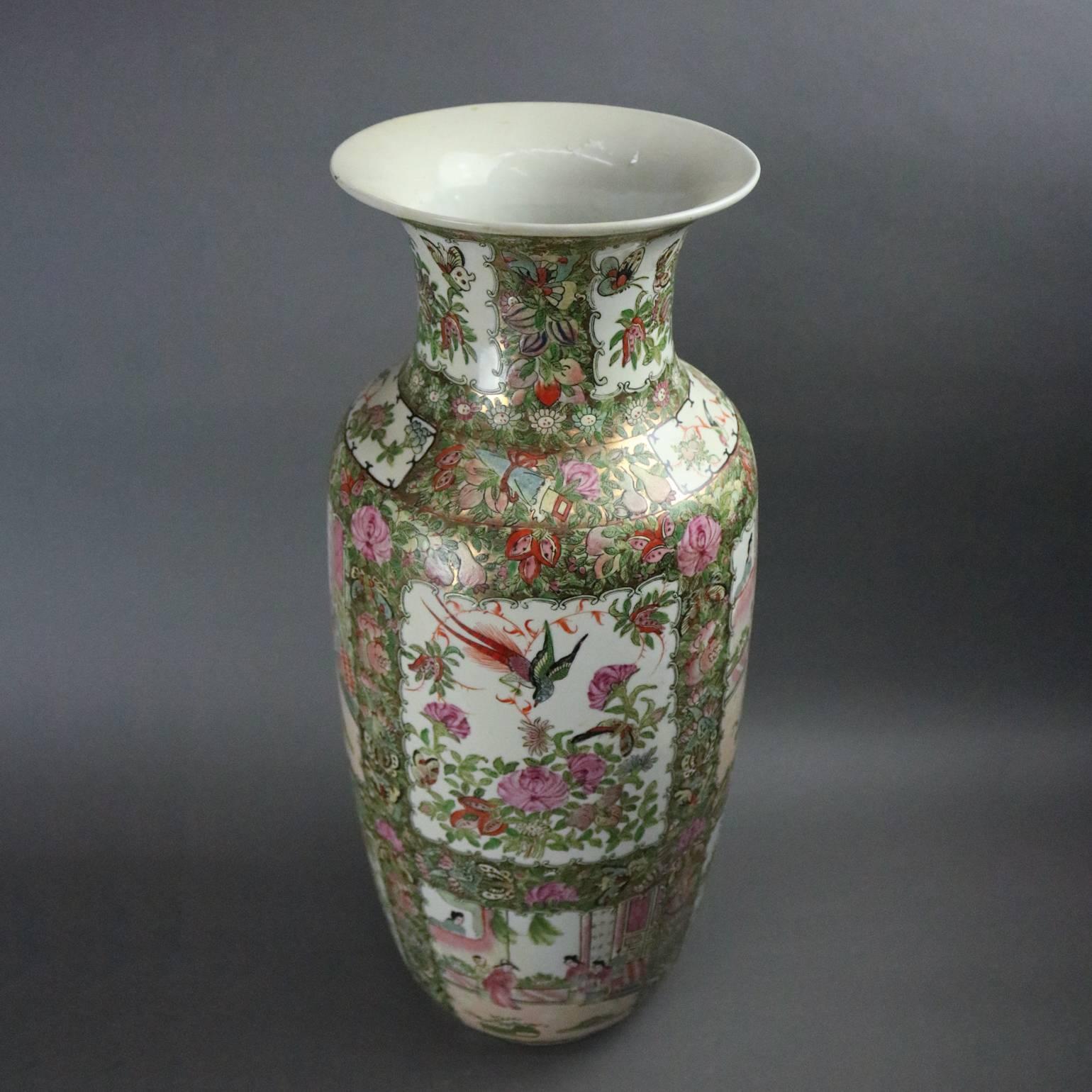 Oversized vintage Chinese rose medallion porcelain vase features traditional paneled design depicting village and garden scenes, chop marks on base, circa 1950

Measures: 25" height x 9" diameter.