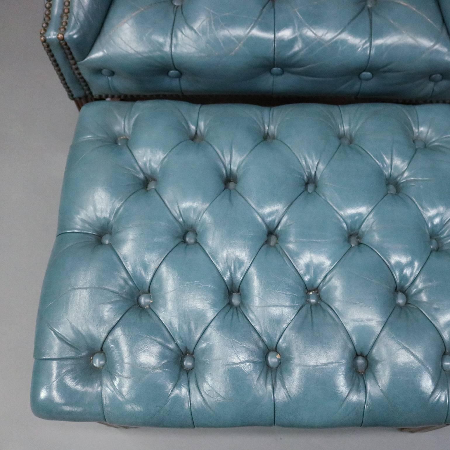 20th Century Hepplewhite Style Leather Chesterfield Wingback Chair and Ottoman, circa 1960