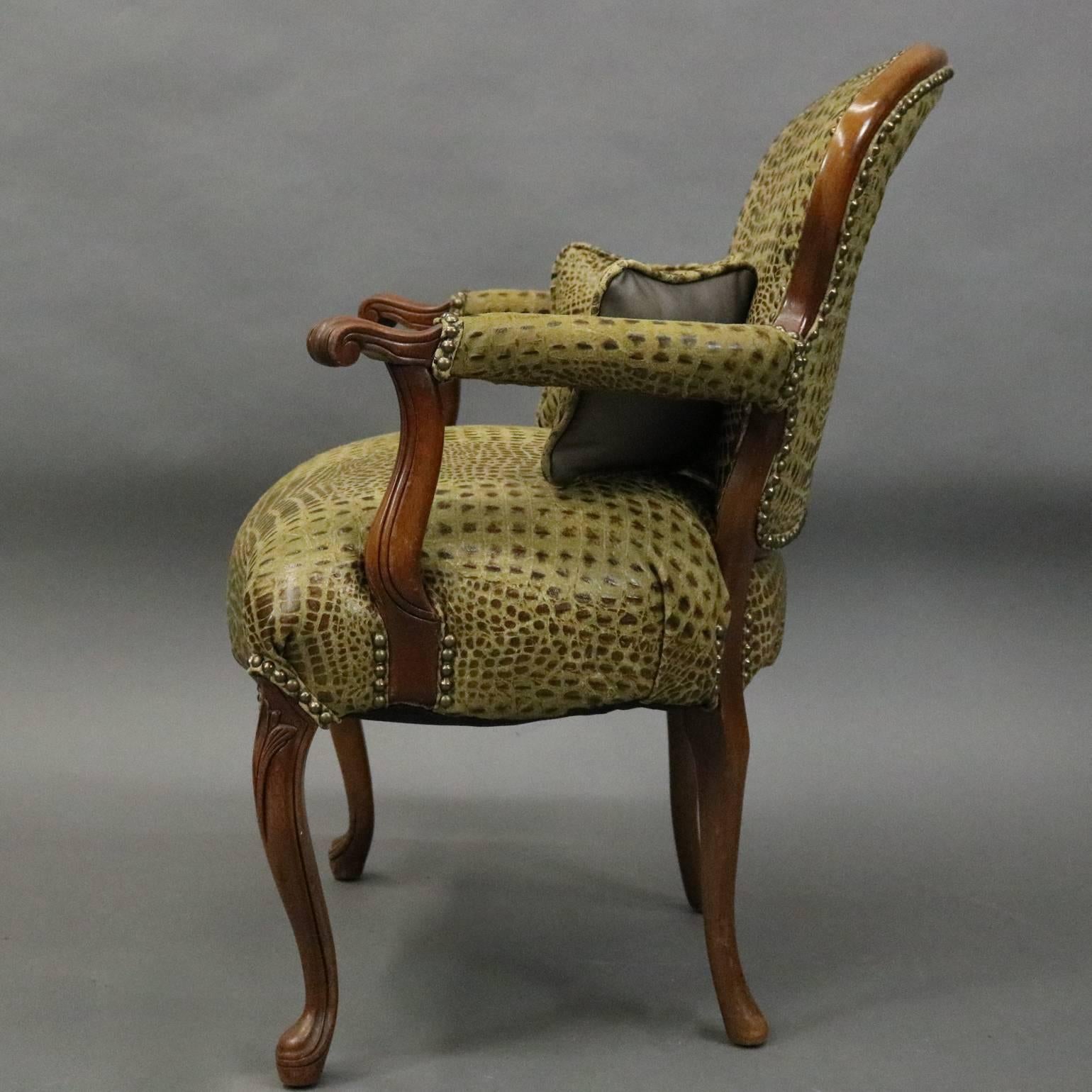 Vintage French, Louis XV style armchair features fruitwood frame with scrolled arms and cabriole legs, upholstered with crocodile/alligator skin patterned leather, three matching pillows, circa 1960

Measures: 35" H x 27" W x 27" D,