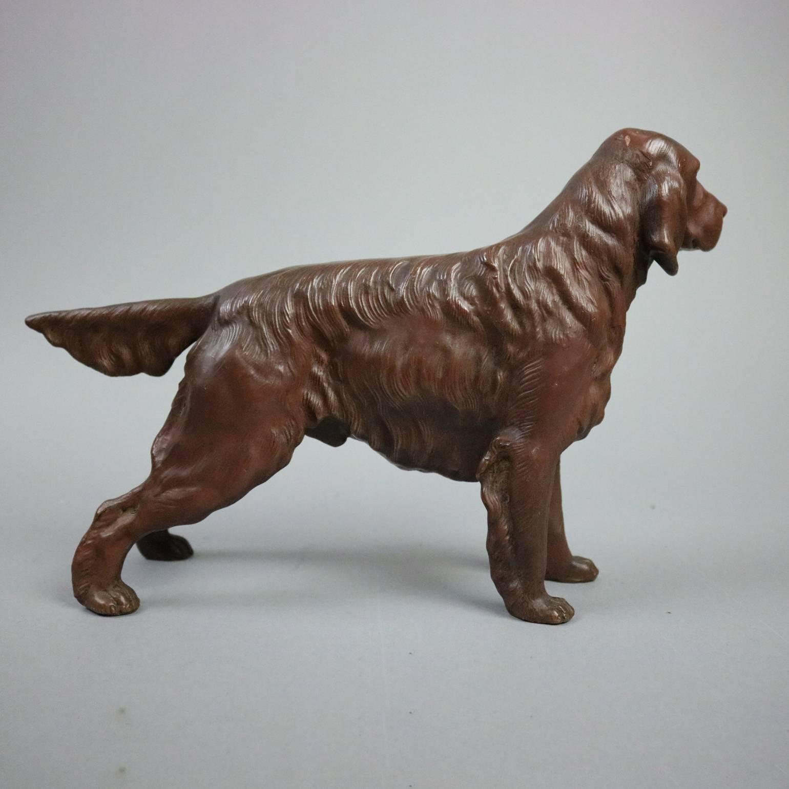 Antique copper over white metal dog sculpture of Irish Setter, circa 1900

Measures: 8" H x 12" W x 2.5" D.