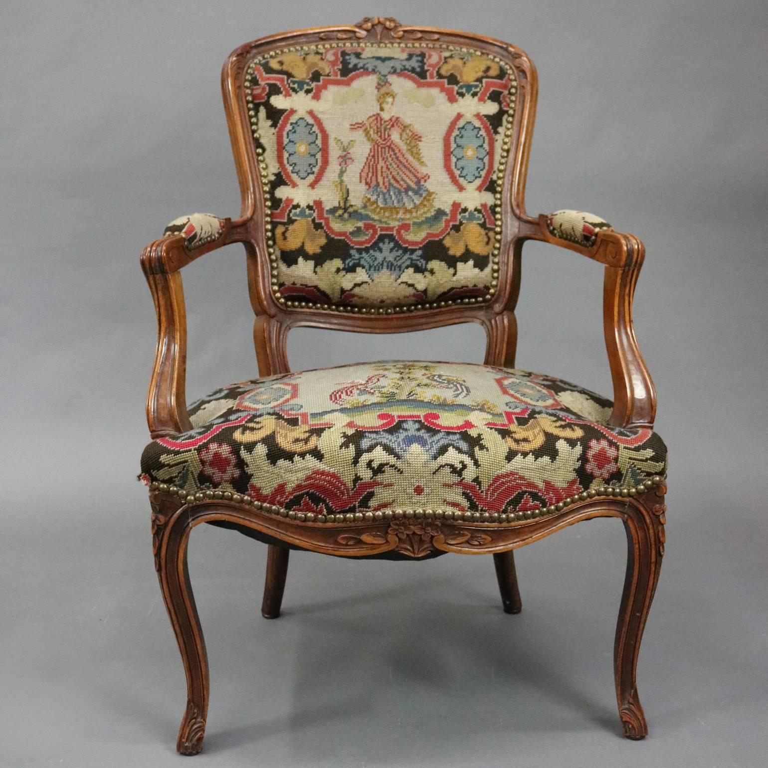 Vintage French, Louis XV classical style carved fruitwood tapestry upholstered arm chair features central design of dancing maiden on back and pair of birds in tree on seat both bordered in acanthus foliate patterning, circa 1940.

Measures: 39