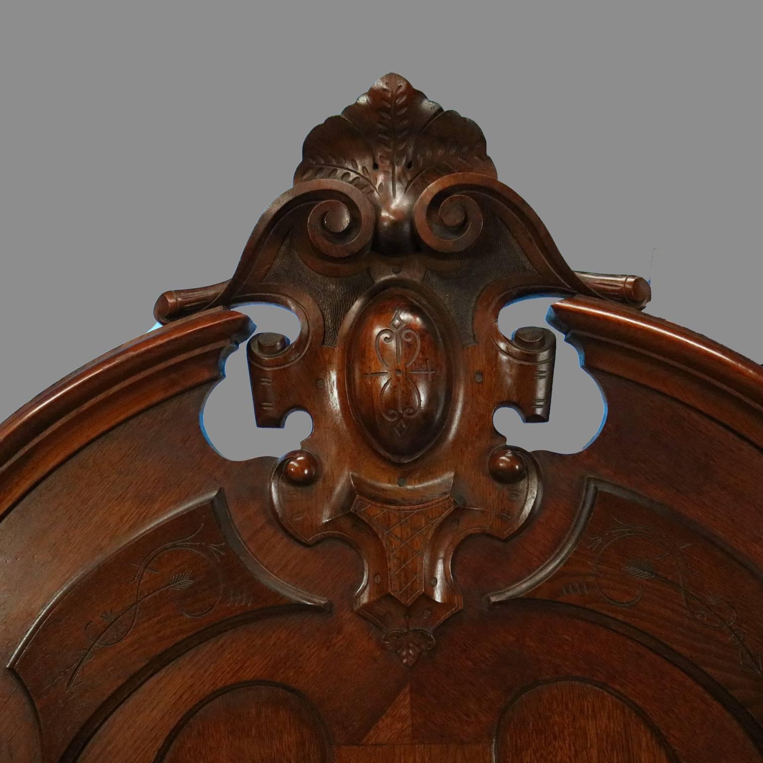 Antique carved walnut Rococo full size bed frame features high back with central scroll and foliate cartouche flanked urn form finials; carved scroll and acanthus decorated footboard, circa 1880.

Measures: 81" H x 6" W (exterior) x