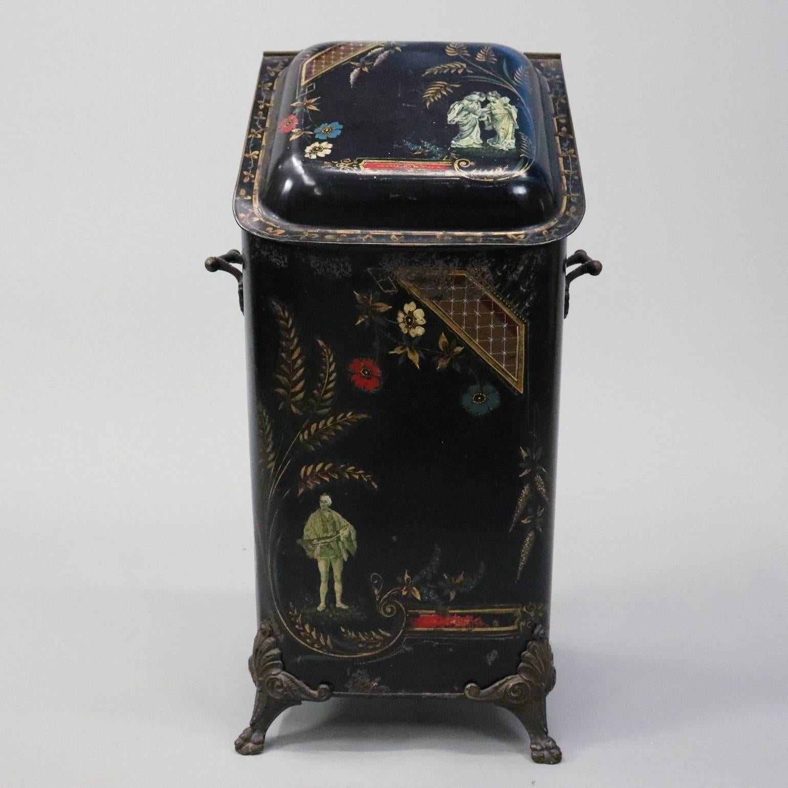 Antique Chinoiserie decorated English coal scuttle features hand-painted gilt foliate decoration, polychrome floral and music man and two whispering ladies; seated on cast paw feet and side handles, circa 1890

Measures: 25" H x 14" W x