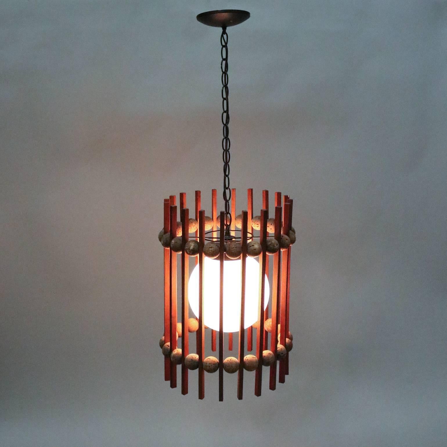 Mid-Century Modern cylinder pendant light features teak slat and cork ball frame, newly re-wired, 20th century.

***DELIVERY NOTICE – Due to COVID-19 we are employing NO-CONTACT PRACTICES in the transfer of purchased items.  Additionally, for those