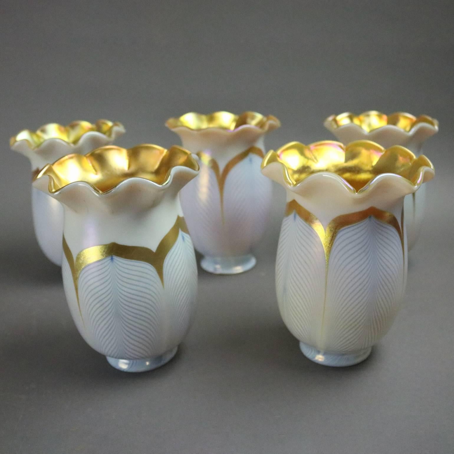 Set of five Art Nouveau gold Aurene and calcite art glass pulled feather lamp shades from the Fredrick Carter era, circa 1920

Measures: 5.75" height x 4" diameter, 2.25" diameter fitter.