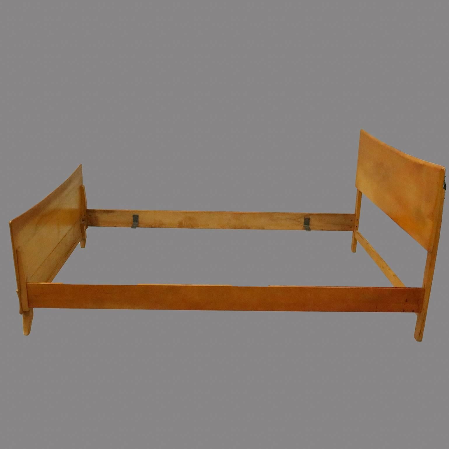 Vintage Heywood-Wakefield Kohinoor double bed frame features Northern Yellow Birch wood construction designed by Ernest Herman, circa 1950

Measures: 35" H (headboard) x 59" W x 79" D, 24" H (footboard)

FYI.......
The M 140