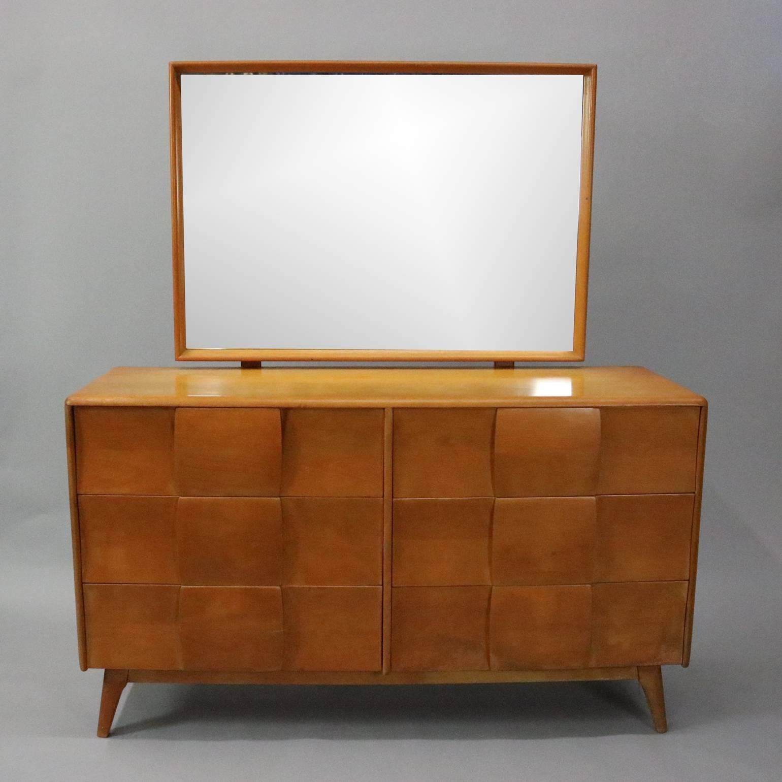 Vintage Heywood-Wakefield Kohinoor six-drawer low chest and mirror features Northern yellow birchwood construction designed by Ernest Herman, circa 1950

Measures: 63" H x 55" W x 19.5" D; 30" H x 41" W
