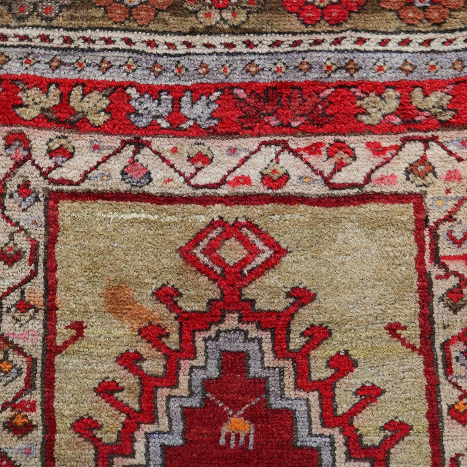 Antique hand-knotted Turkish prayer rug features hand woven vegetable dyed wool in geometric, floral and foliate design, circa 1900

Measures: 64"x 44".