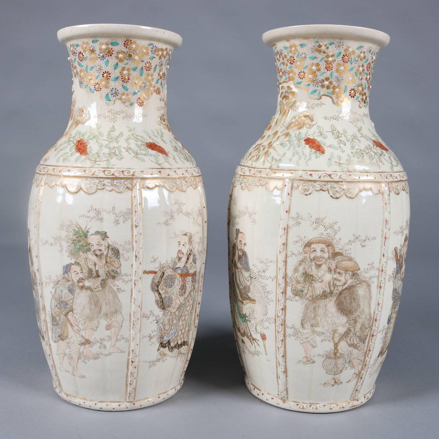 Pair of antique and fine Japanese Satsuma Meiji pottery vases feature hand-painted and gilt foliate, floral and scroll decoration with reserves depicting portraits of elder wise men, circa 1870.

Measure: 14" H x 7" Diam.