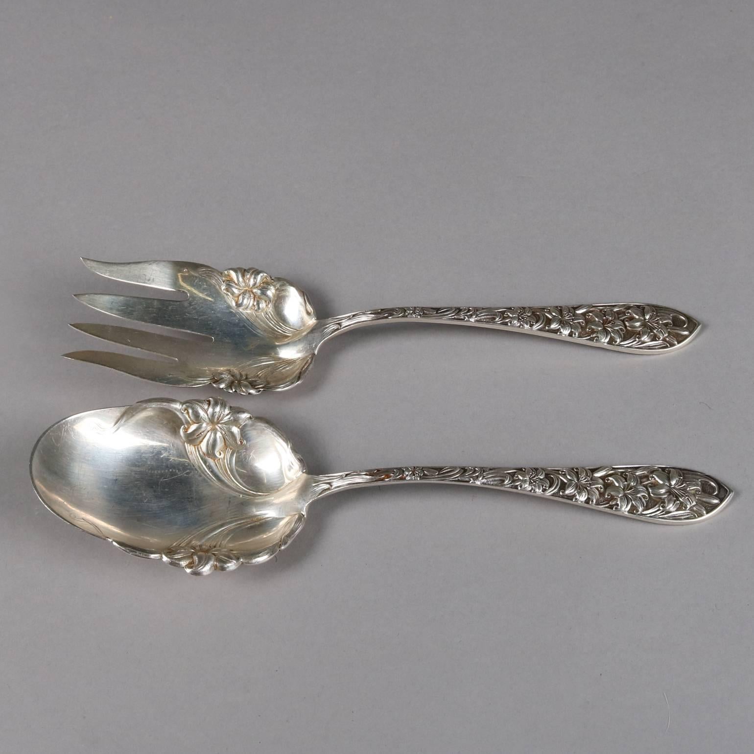 Pair of antique sterling silver serving fork and spoon by Frank M. Whiting, floral motif, marked Sterling, 19th century

Measure: 9.5" x 2.75.
  
 