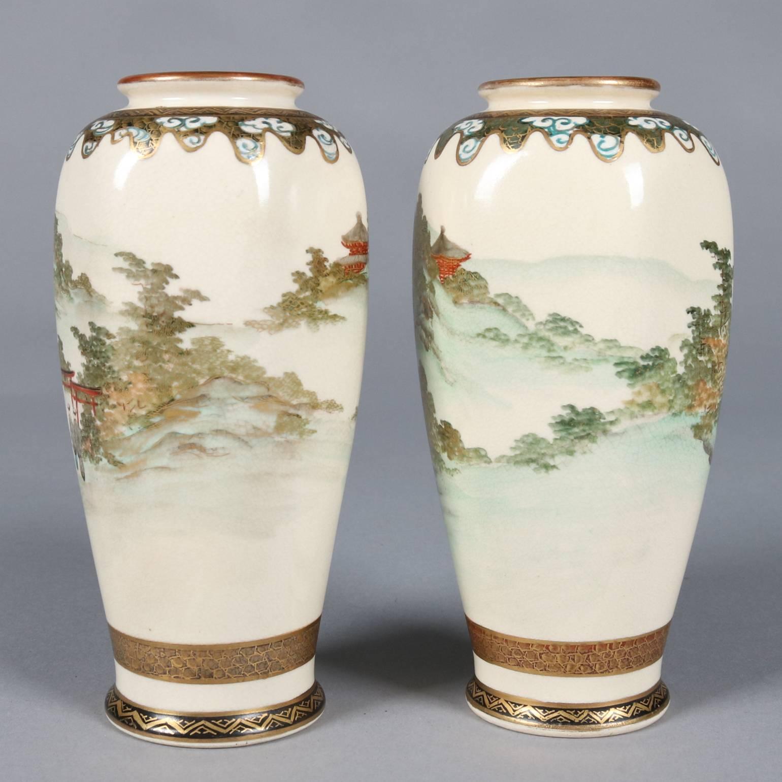 Pair of antique Japanese art pottery Satsuma cabinet vases feature hand-painted and gilt landscape with village scenes, original label on bases, circa 1900

Measure: 6.5" H x 3"diam.
 