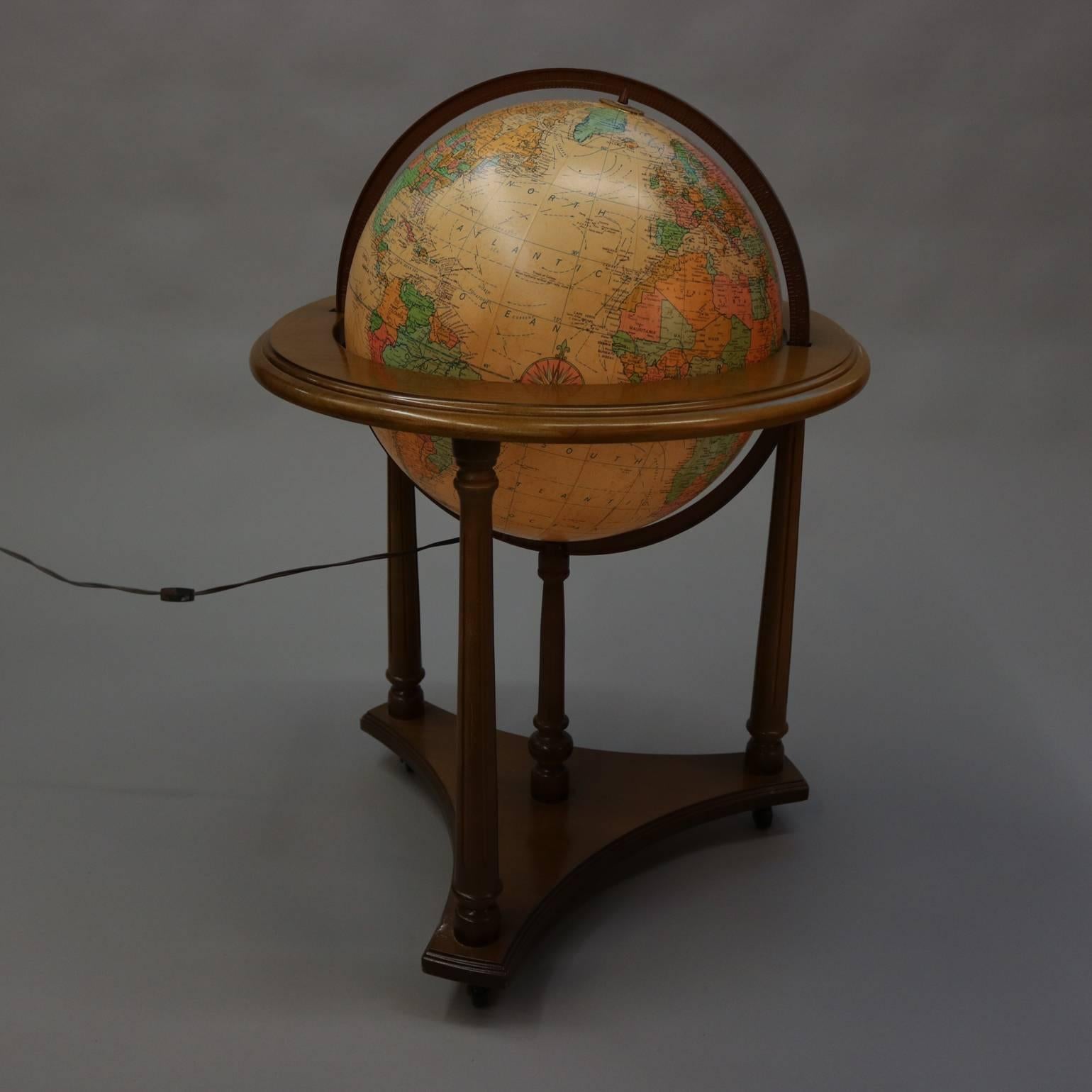 Vintage lighted Heirloom Globe library world globe by Replogle on mahogany tripod floor stand, 20th century.

Measures: 35" H x 21" diameter.