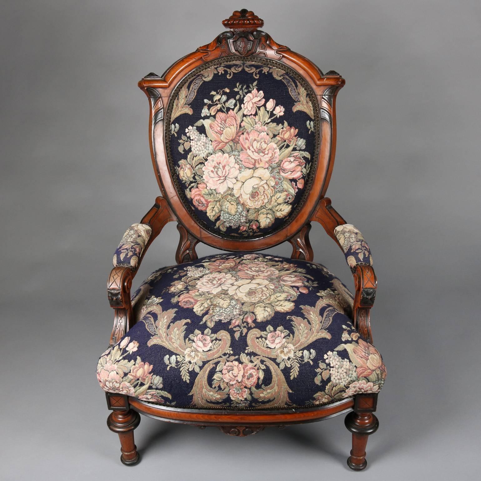 Antique Renaissance Revival Parlor set features carved scrolled and foliate mahogany frame with ebonized accents with floral upholstery and includes settee and armchair, circa 1860

Measures: 47" H x 67" W x 23" D, settee; 40" H