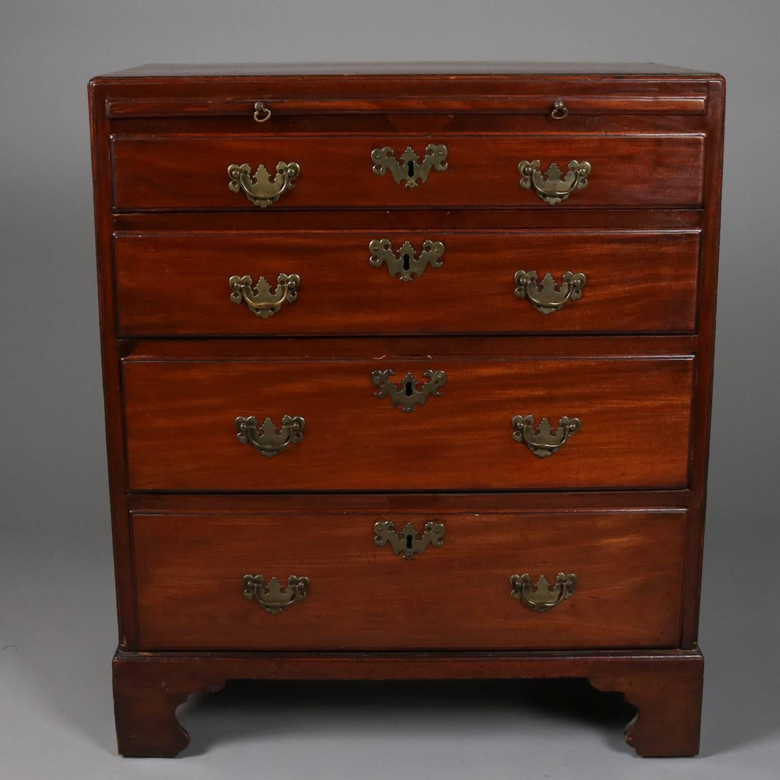 18th century antique English mahogany silverware chest features four drawers, pull out work tray and bronze hardware, seated on ogee legs.

Measures - 34"H X 28.5"W X 17"D.