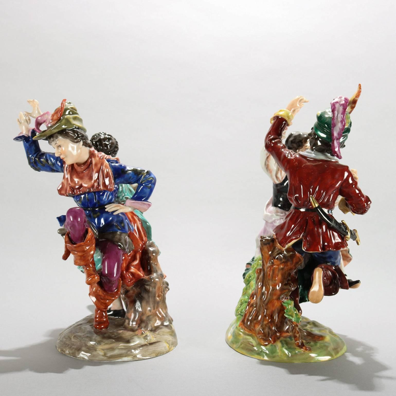 Set of two antique hand-painted German Dresden porcelain figurines of old world couples celebrating and dancing, circa 1850

Measure: 9" H x 7" W x 4.5" D.
