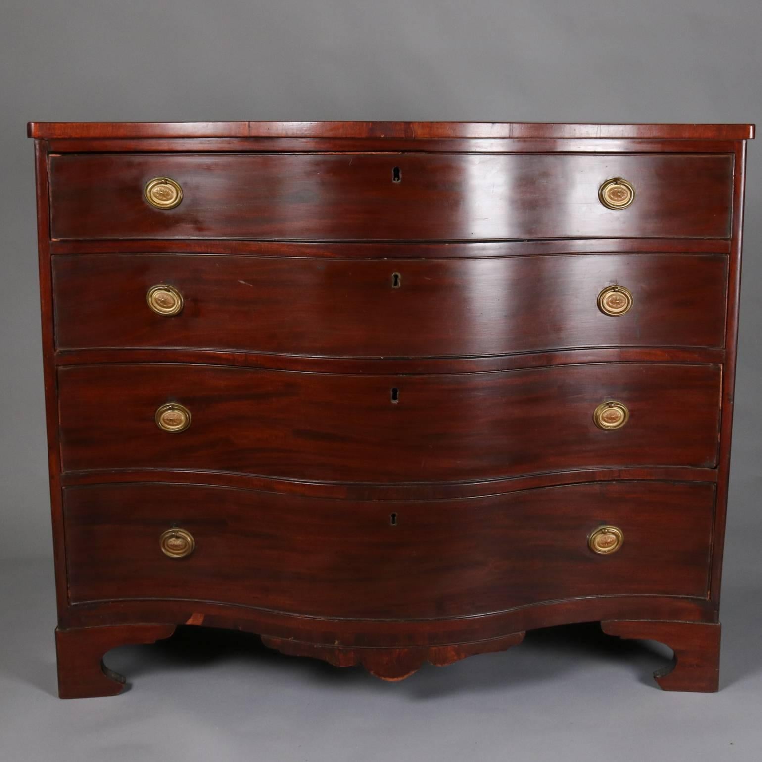 19th century English swell front dresser features mahogany construction with four long drawers and seated on ogee feet, bronze pulls

Measures - 38