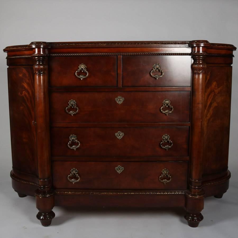 Oversized French flame mahogany sideboard features flanking columns, cared acanthus decoration; two drawers over three long drawers with flanking bow front storage cabinets; bronze pulls throughout; 20th century.

Measures - 37"H X 67"W