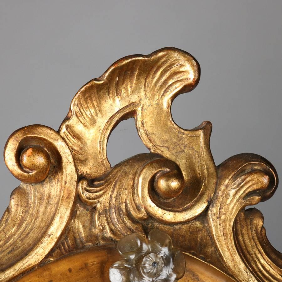 Antique Venetian Rococo style diminutive wall mirror features carved giltwood frame with pierced scroll and foliate decoration, floral and foliate etched mirror, 19th century.

***DELIVERY NOTICE – Due to COVID-19 we are employing NO-CONTACT