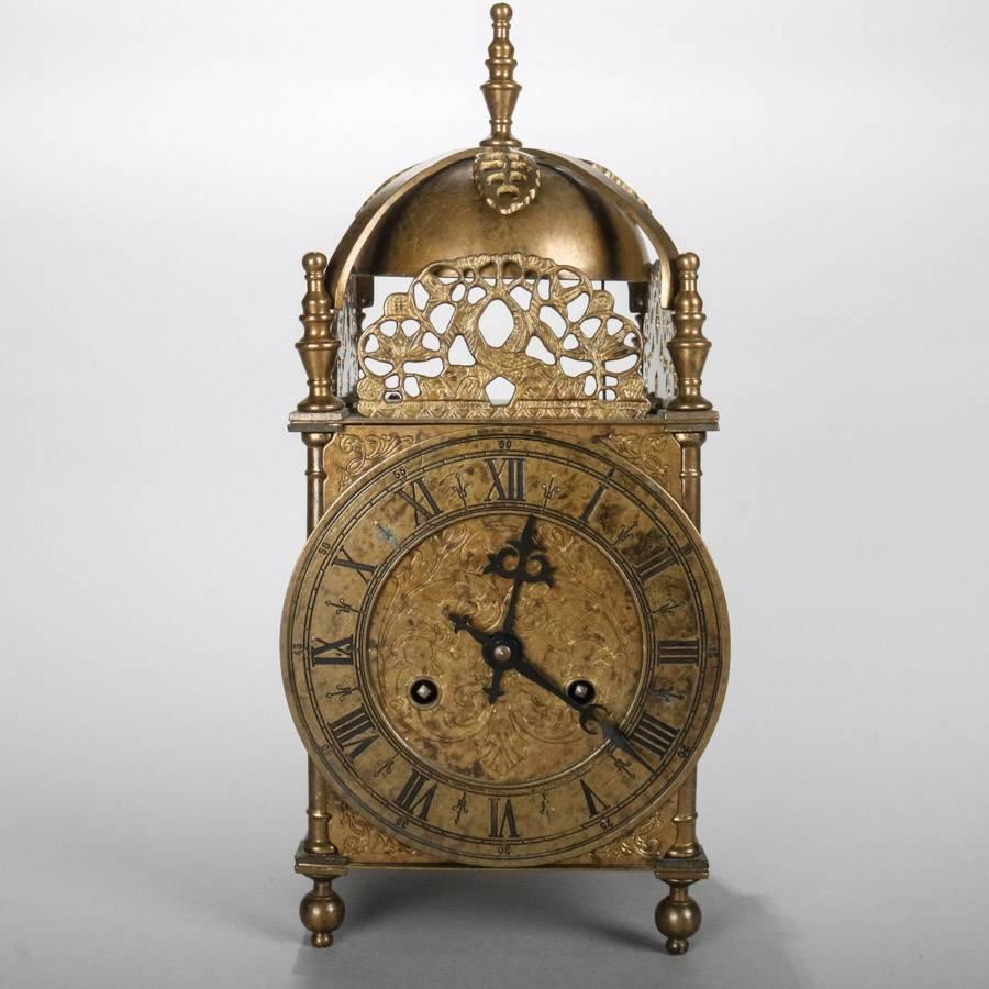 Antique George III style German bronze mantel clock by Bulova Watch Company, Inc. features ornate incised foliate design, pierced foliate form crest around dome top and flanked by corner and center finials, clock is in working condition, 19th