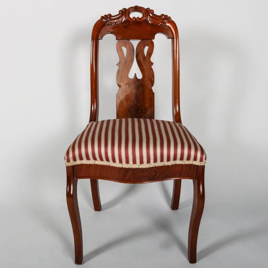 Set of six French antique Gondola chairs feature flame mahogany construction with pierced slat back reminiscent of lyre with opposing swan cut-out topped by pierced c-scroll crests and striped upholstered seats, 19th century

Measure: 33" H x