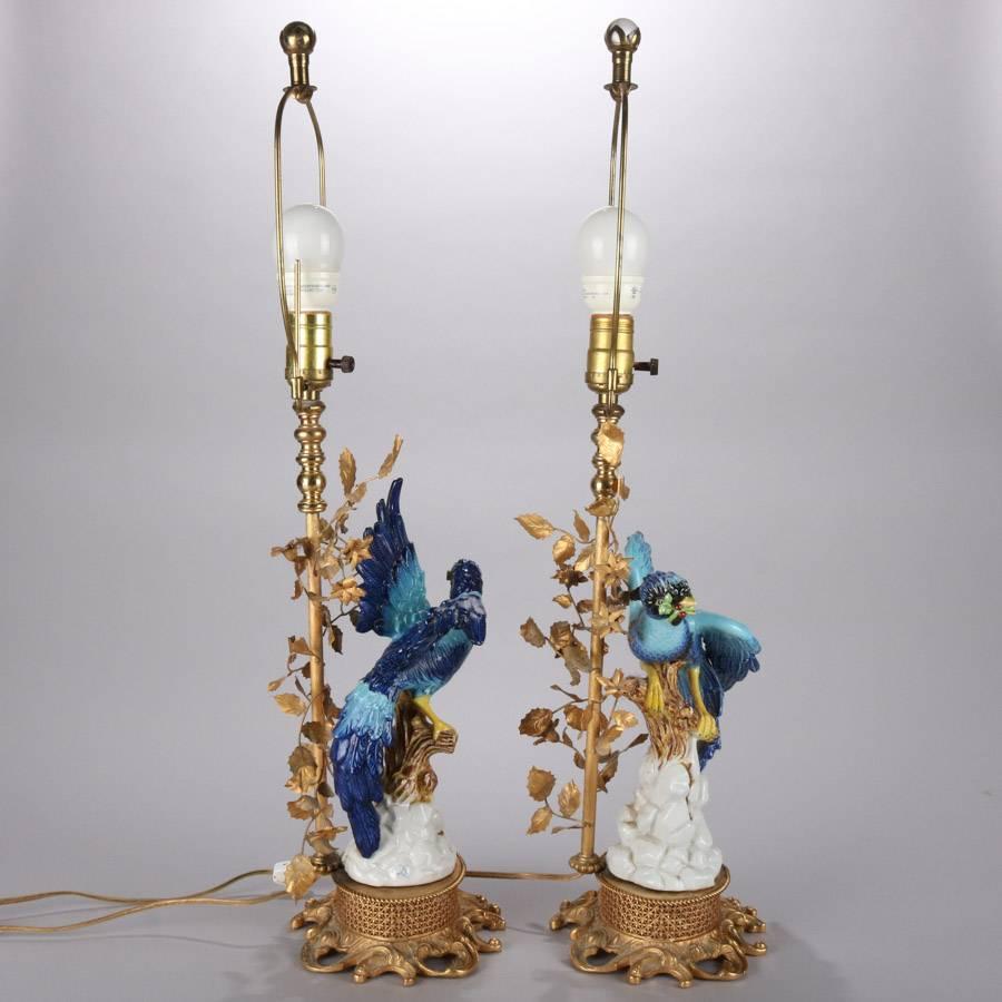 Pair of antique French Sevres figural table lamps with hand-painted and porcelain blue birds taking flight with foliate form bronze base, signed with double 