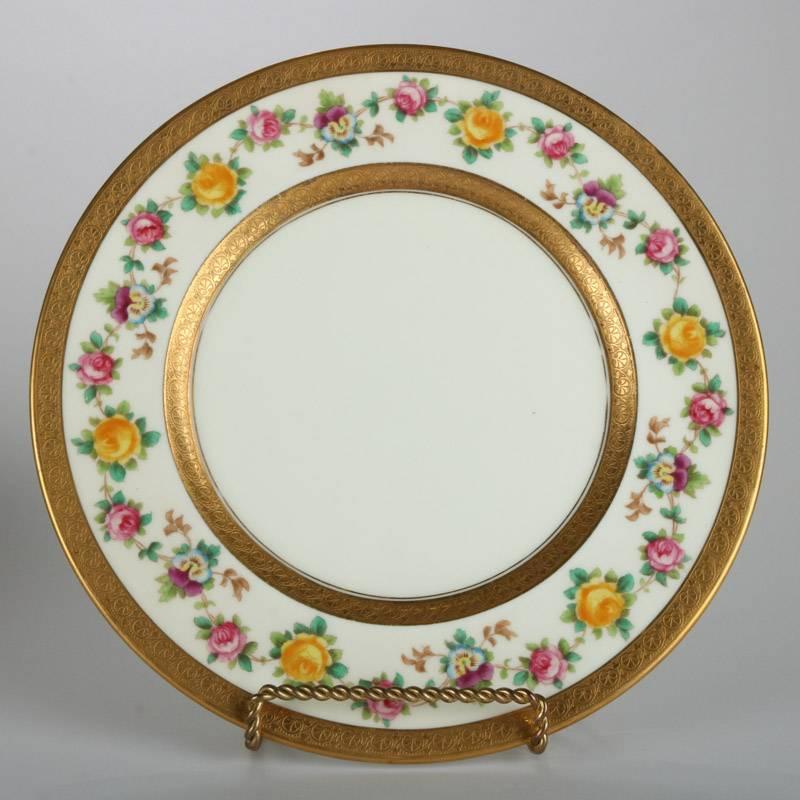 Set of 12 antique English Brown-Westhead Moore & Co. gilt and floral hand-painted porcelain dishes feature rose and pansy border with gilt trim, circa 1880

Measures: 9" diameter.