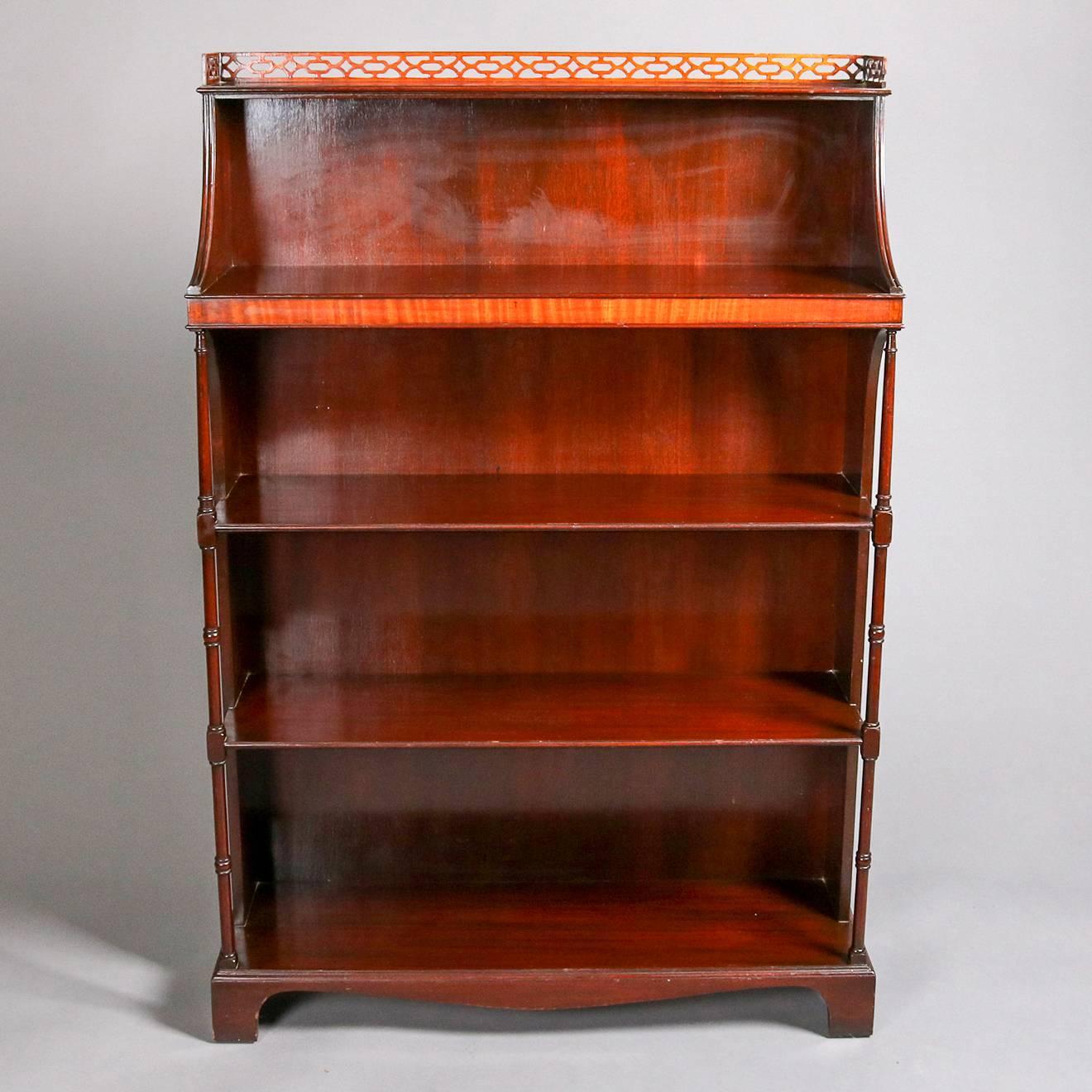 Antique federal style bookshelf by Charak Furniture Co. features mahogany construction with pieced gallery above four open shelves, flanked by semi-open sides with column supports, original Charak Furniture Co., Boston Mass. label on back, 19th