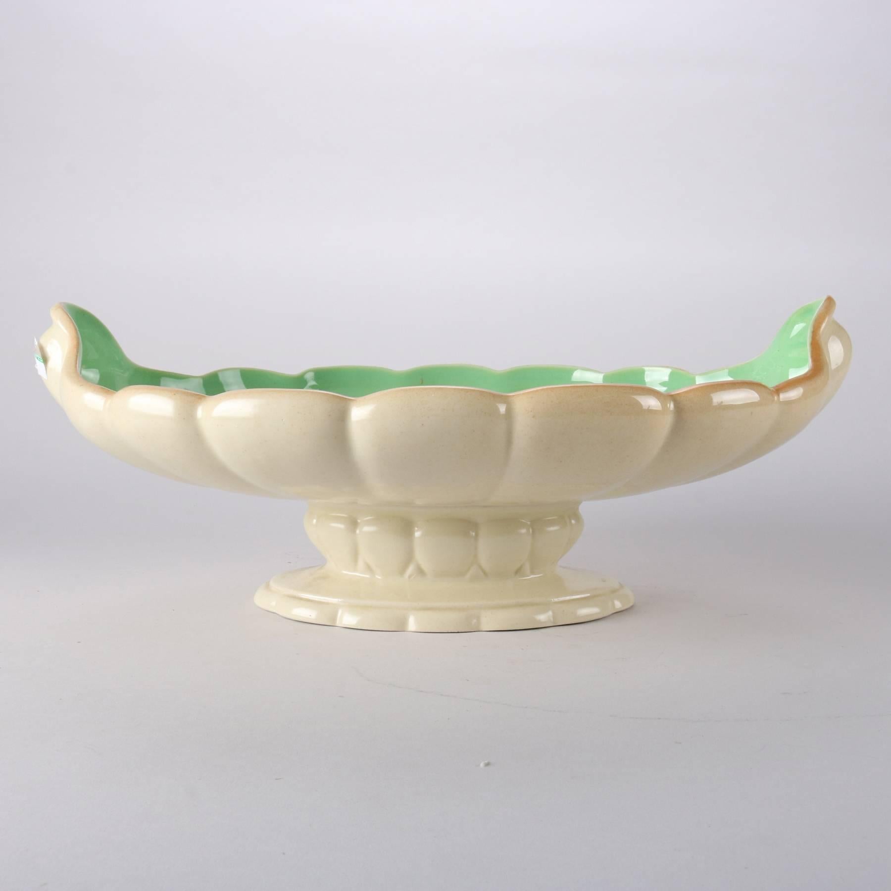 Antique Art Nouveau Cowan art pottery center console bowl features scallop form bowl atop pedestal base, pottery maker mark on base, 20th century

Measures - 6