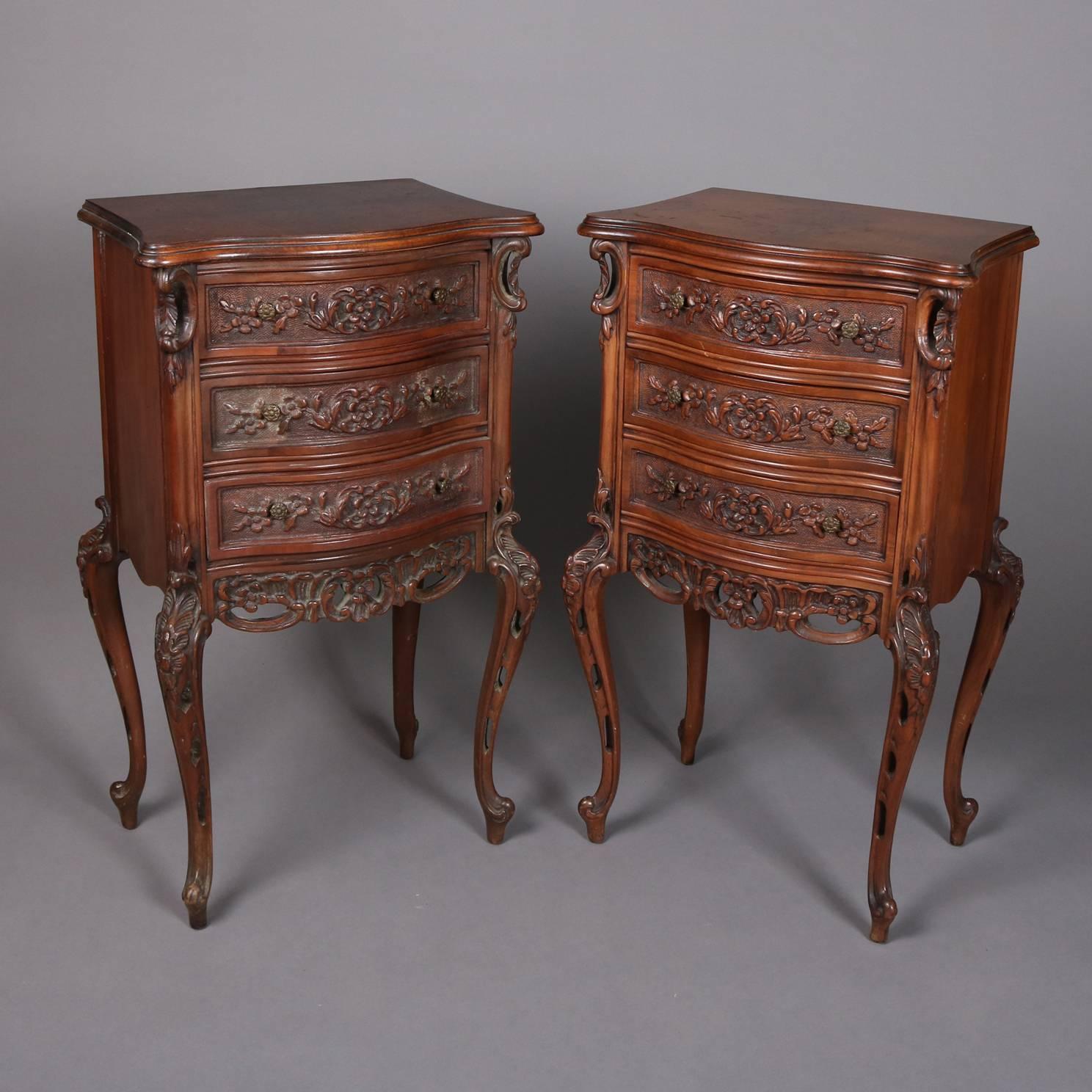 Pair of Antique French mahogany stands feature three drawers with carved floral and foliate decoration, pierced apron and seated on cabriole legs, 20th century

Measures: 30